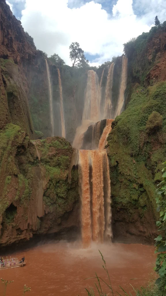 Ouzoud Waterfalls cascading down rocky cliffs in Morocco