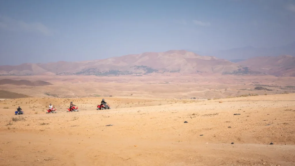Quad bikers riding across the Agafay Desert