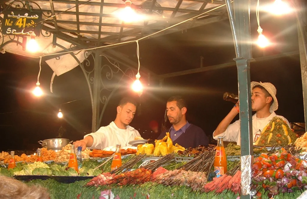 Chefs at a food stall in Jemaa el-Fnaa Marrakech