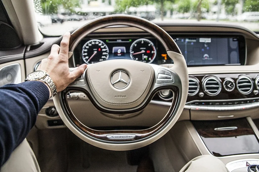 Driver at the wheel of a Mercedes-Benz